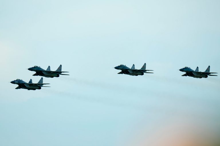 Slovak Air Force MiG-29s fly over an airport during an airshow in Malacky, Slovakia, Saturday, Aug. 27, 2022. Poland and Czech Republic signed an agreement promising to protect Slovak airspace as Slovakia retires its old Soviet-made MiG-29 jets at the end of this month. That protection is meant to last until Slovakia receives new F-16s from the United States, something expected in 2024. Poland announced its intentions to send four of its MiG-29s to Ukraine in the coming days. (AP Photo/Petr David Josek)
