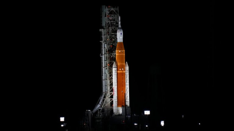 NASA's new moon rocket is illuminated by xenon lights as she sits on Launch Pad 39-B hours ahead of a planned launch at the Kennedy Space Center Saturday, Sept. 3, 2022, in Cape Canaveral, Fla. 
