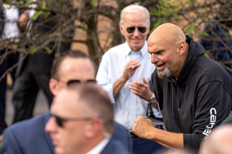 President Joe Biden looks on as Lt. Gov. John Fetterman, a candidate for U.S. Senate, jogs to the stage to speak at a Labor Day event at United Steelworkers of America Local Union 2227 in West Mifflin, Pennsylvania, Monday, Sept. 5, 2022. 