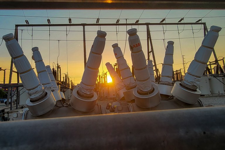 The sun sets behind a high power station in downtown Los Angeles on Sept. 6.