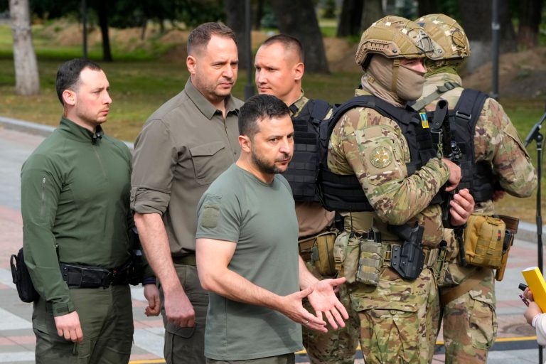 Ukrainian President Volodymyr Zelensky (center) reacts after his press conference in Kyiv, Ukraine, on Sept. 9, 2022.