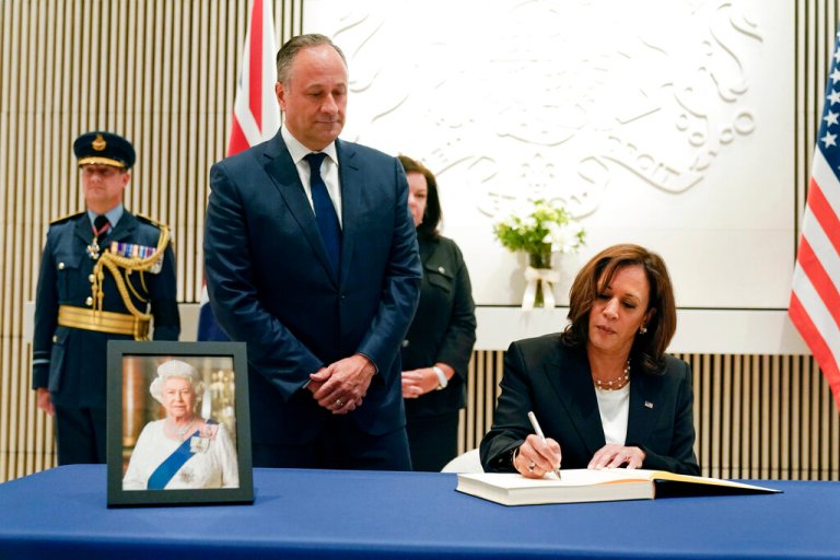 Vice President Kamala Harris (right) signs a condolence book at the British Embassy in Washington, Friday, Sept. 9, 2022, for Queen Elizabeth II.