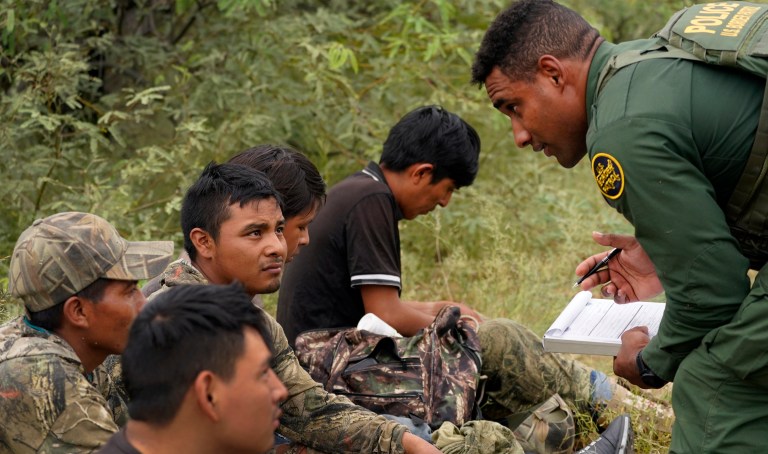 A group of migrants are processed after being apprehended by U.S. Border Patrol agents in the desert at the base of the Baboquivari Mountains, Thursday, Sept. 8, 2022, near Sasabe, Ariz. 