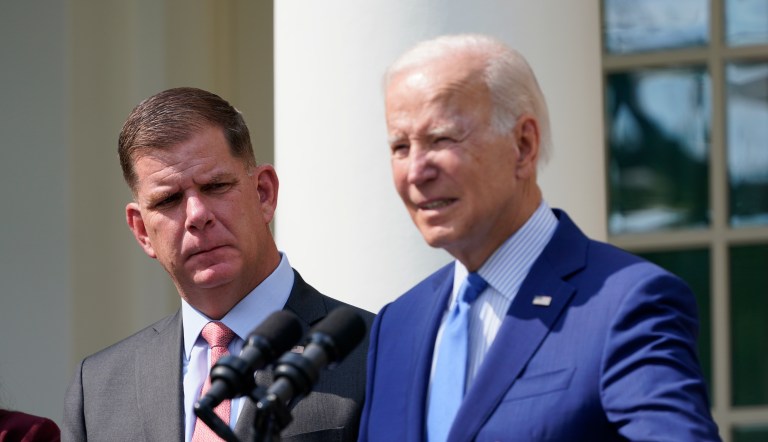 President Joe Biden, with Secretary of Labor Marty Walsh, left, speaks about a tentative railway labor agreement in the Rose Garden of the White House, Thursday, Sept. 15, 2022, in Washington.