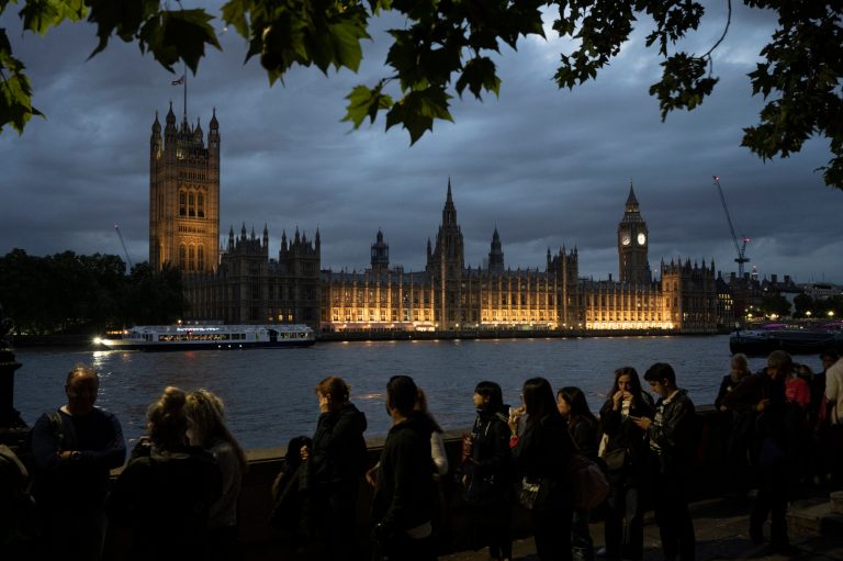 People queue to pay their respects to the late Queen Elizabeth II during the lying-in-state outside Westminster Hall in London on Sept. 15, 2022.