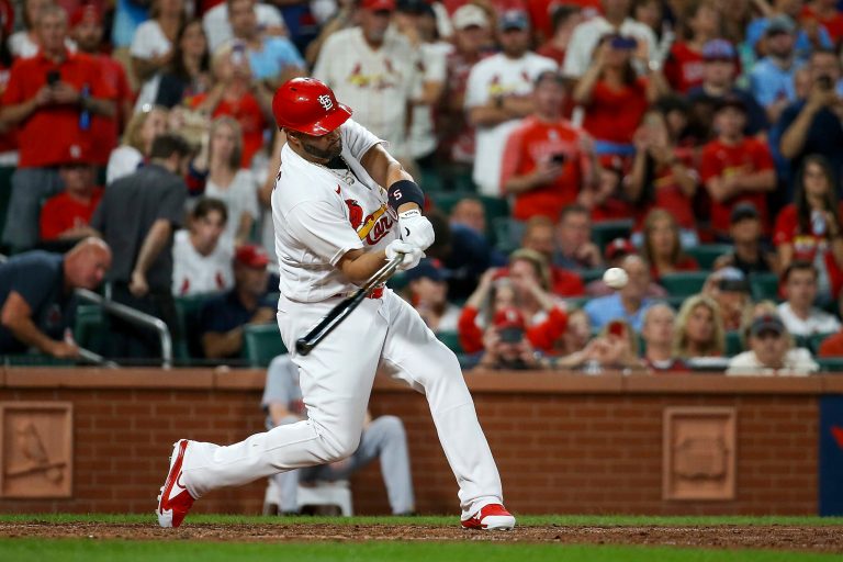 St. Louis Cardinals' Albert Pujols hits a two-run home run during the sixth inning of a baseball game against the Cincinnati Reds, Friday, Sept. 16, 2022, in St. Louis.