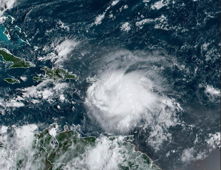 This satellite image provided by NOAA shows Tropical Storm Fiona in the Caribbean on Saturday, Sept. 17, 2022. Fiona threatened to dump up to 16 inches (41 centimeters) of rain in parts of Puerto Rico on Saturday as forecasters placed the U.S. territory under a hurricane watch and people braced for potential landslides, severe flooding, and power outages.