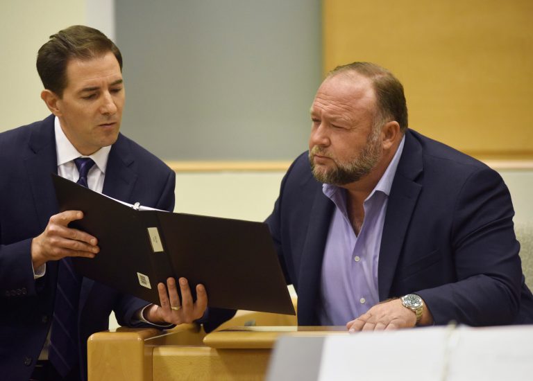 Plaintiff's attorney Chris Mattei, left, questions Conspiracy theorist Alex Jones during testimony at the Sandy Hook defamation damages trial at Connecticut Superior Court in Waterbury, Conn. Thursday, Sept. 22, 2022. 