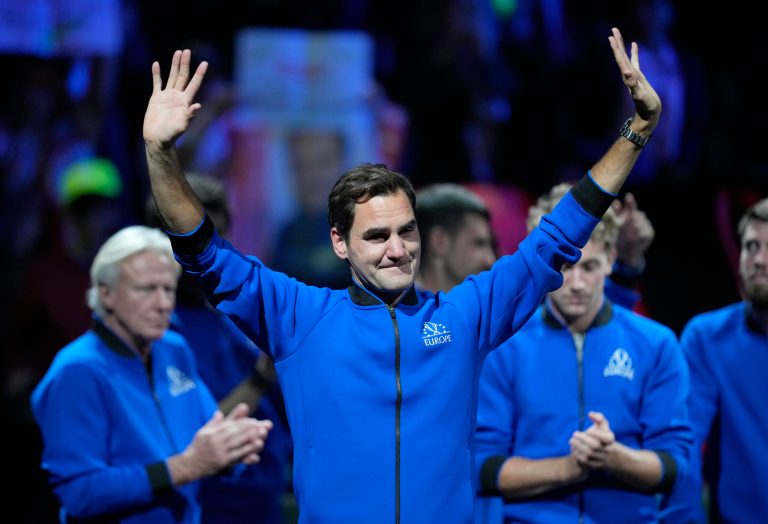 An emotional Roger Federer acknowledges the crowd after playing his final match.