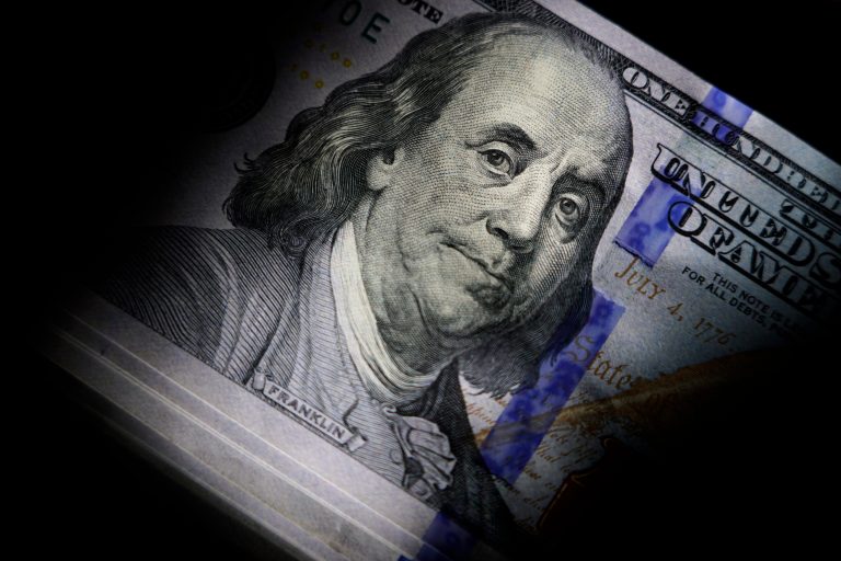 The likeness of Benjamin Franklin is seen on U.S. $100 bills, Thursday, July 14, 2022, in Marple Township, Pennsylvania. (AP Photo/Matt Slocum)