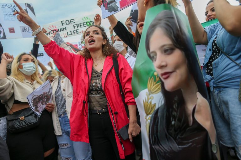 Women shout slogans during a protest against the death of Iranian Mahsa Amini, in Istanbul, Turkey, Sunday, Oct. 2, 2022. 