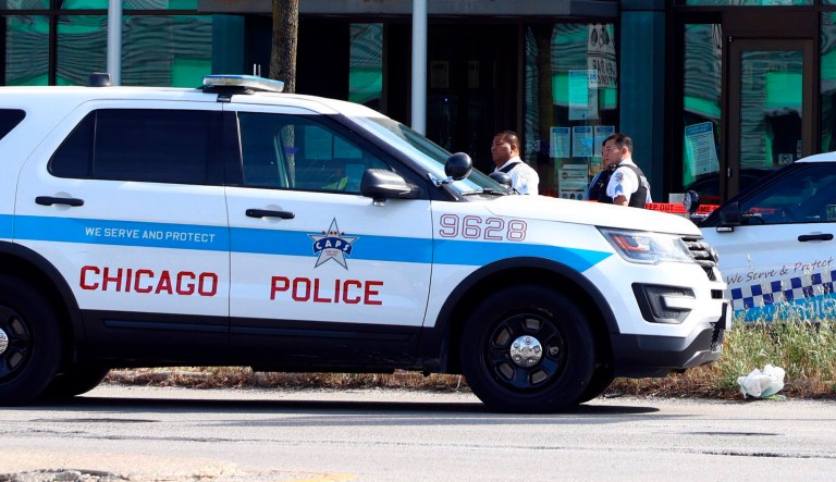 Police gather outside the Ogden District police station. 