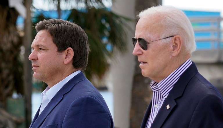 President Joe Biden and Florida Gov. Ron DeSantis arrive to tour an area impacted by Hurricane Ian on Wednesday, Oct. 5, 2022, in Fort Myers Beach, Fla.