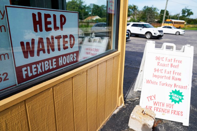 Help wanted sign is displayed in Deerfield, Illinois, Wednesday, Sept. 21, 2022. More Americans filed for unemployment benefits last week, but the labor market remains strong even in the face of persistent inflation and a slowing overall U.S. economy. Jobless claims for the week ending Oct. 1 rose by 29,000 to 219,000, the Labor Department reported Thursday, Oct. 6.