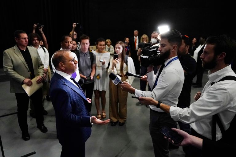 Libertarian candidate for the U.S. Senate seat in Arizona, Marc Victor speaks to the media after a televised debate in Phoenix, Thursday, Oct. 6, 2022. Victor dropped out of the race on Tuesday, Nov. 1 and gave his endorsement to Blake Masters. (AP Photo/Ross D. Franklin)