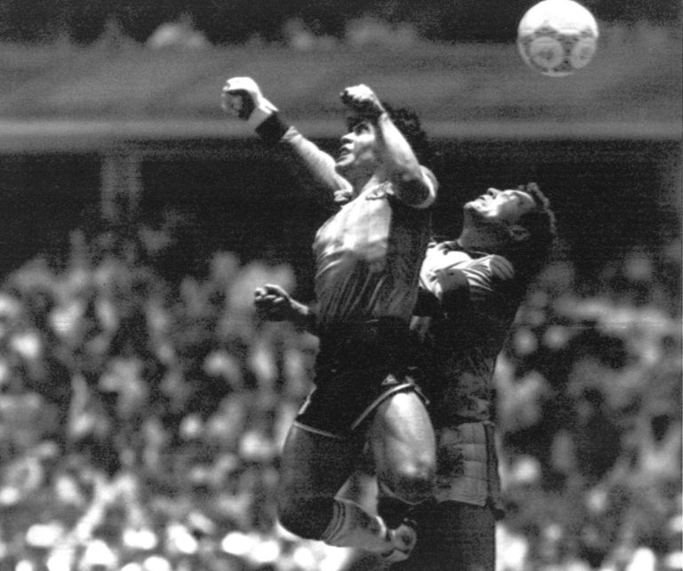 FILE - Argentina's Diego Maradona, left, beats England goalkeeper Peter Shilton to a high ball and scores his first of two goals in a World Cup quarterfinal soccer match.