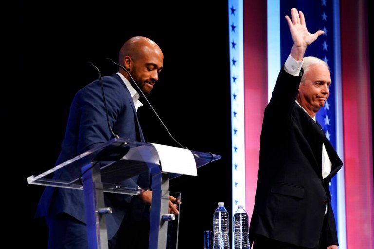 Sen. Ron Johnson, right, and Democratic Senate candidate Mandela Barnes, left, are introduced during a televised debate Thursday, Oct. 13, 2022, in Milwaukee, Wisconsin