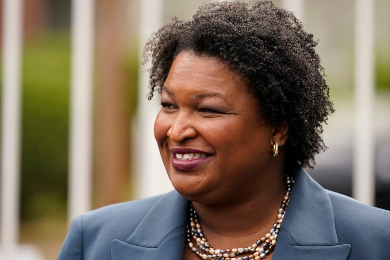 Georgia Democratic gubernatorial candidate Stacey Abrams talks to the media during Georgia's primary election on Tuesday, May 24, 2022, in Atlanta.