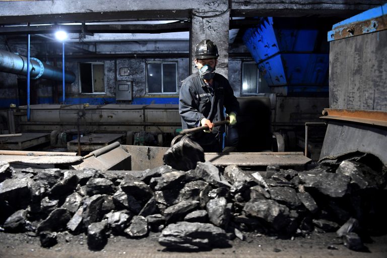 In this photo released by Xinhua News Agency, a worker sort coals at Qianyingzi coal mine in Suzhou, east China's Anhui Province, Oct. 20, 2021. China plans to boost coal production through 2025 to avoid a repeat of last year's power shortages, an official said Monday, Oct. 17, 2022. adding to setbacks in efforts to cut climate-changing carbon emissions from the biggest global source.