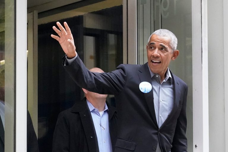 Former President Barack Obama waves to the crowd after casting his ballot at an early voting site Monday, Oct. 17, 2022, in Chicago.