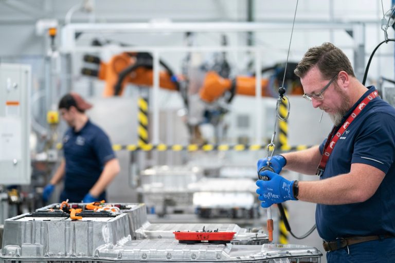 Employees work in the battery assembly hall at the BMW Spartanburg plant.