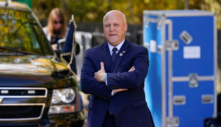 Mitch Landrieu, senior adviser and Infrastructure Act implementation coordinator, waits for President Joe Biden to speak about his infrastructure agenda at Fern Hollow Bridge in Pittsburgh, Thursday, Oct. 20, 2022. 