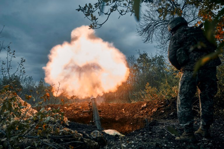 Ukrainian soldiers fire the Russian positions with the mortar in Bakhmut, Donetsk region, Ukraine, Friday, Oct. 21, 2022. 