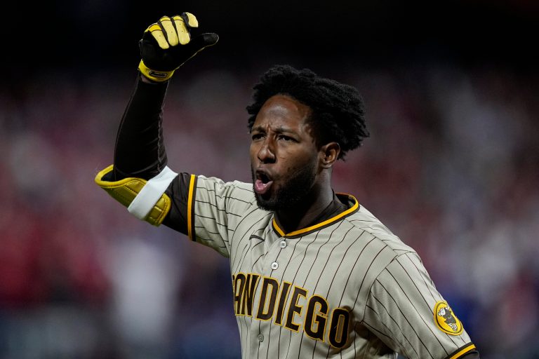 The San Diego Padres' Jurickson Profar reacts after striking out during the ninth inning in Game 3 of the baseball NL Championship Series between the San Diego Padres and the Philadelphia Phillies on Friday, Oct. 21, 2022, in Philadelphia.