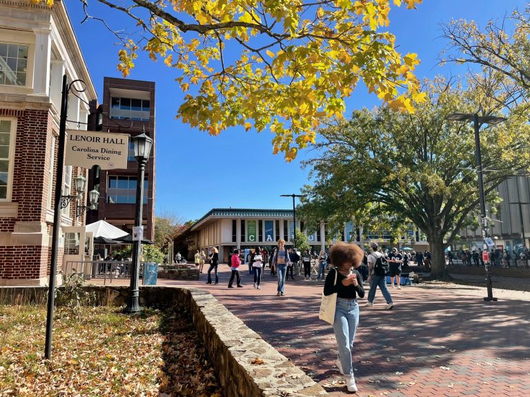Students walk through the quad outside the student union at the University of North Carolina at Chapel Hill on Oct. 24. The Supreme Court is reviewing a case about the university's consideration of race in the admissions process. 