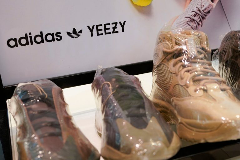 A sign advertises Yeezy shoes made by Adidas at Kickclusive, a sneaker resale store, in Paramus, New Jersey.