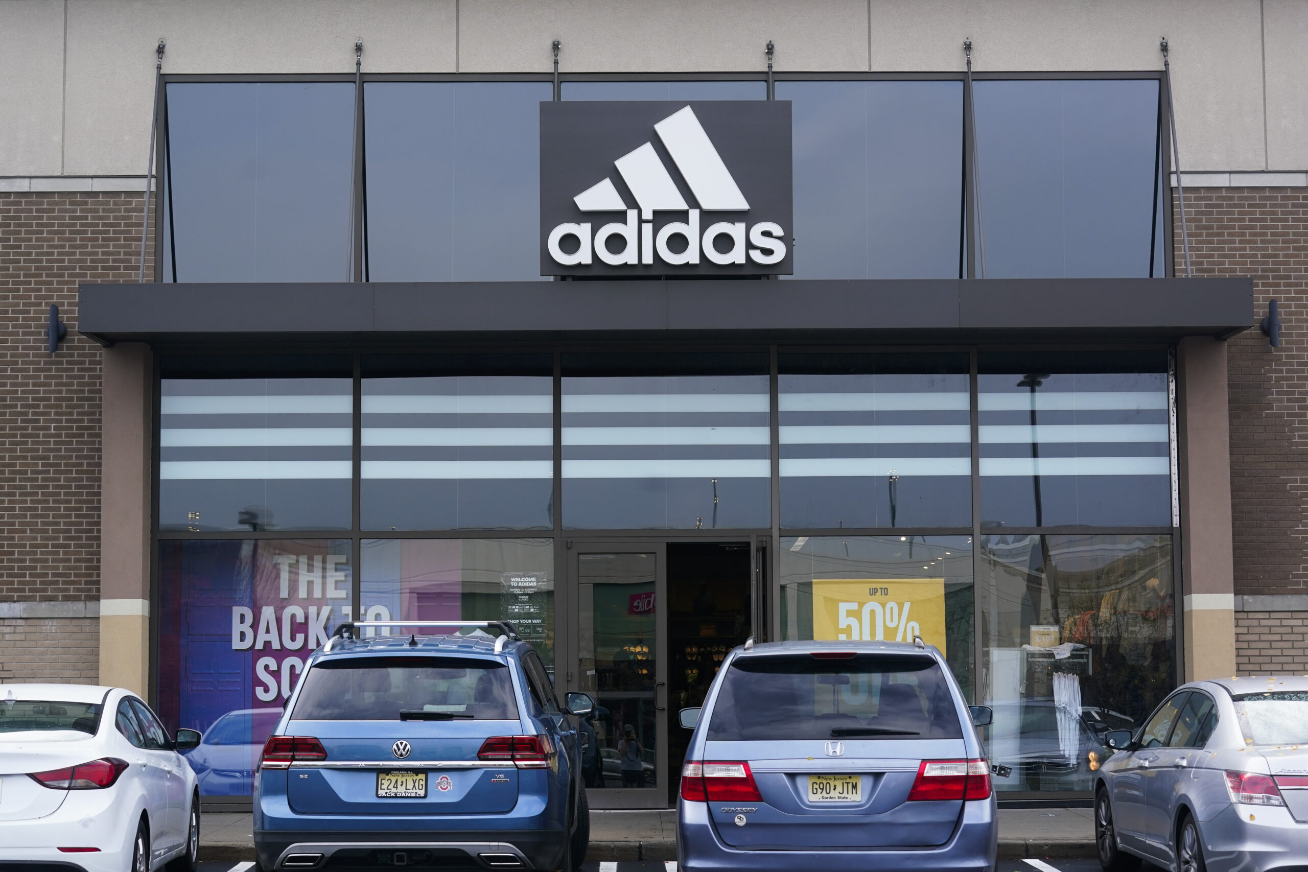 Adidas cuts earnings forecast in half after parting with Kanye West