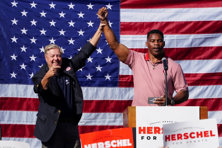 Herschel Walker, right, Republican candidate for U.S. Senate in Georgia, poses with Sen. Lindsey Graham, R-S.C. after speaking during a campaign stop in Cumming, Ga., Thursday, Oct. 27, 2022.