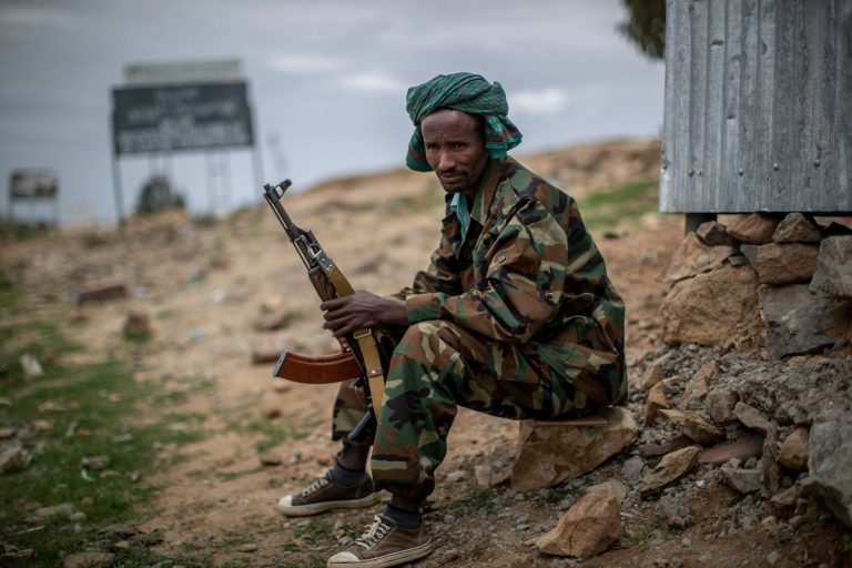 FILE - A fighter loyal to the Tigray People's Liberation Front (TPLF) mans a guard post on the outskirts of the town of Hawzen in the Tigray region of northern Ethiopia on May 7, 2021.