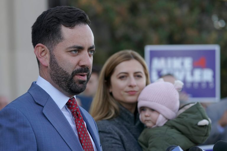 Mike Lawler, left, is joined by his wife Doina and daughter Julianna as he speaks during a news conference, Wednesday, Nov. 9, 2022, in New City, N.Y.