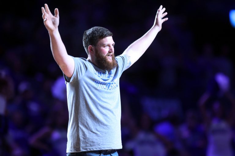 Coal miner Michael McGuire is introduced during the second half of an NCAA college basketball game between Kentucky and Duquesne in Lexington, Ky., Friday, Nov. 11, 2022. An image of McGuire covered in coal dust at a Kentucky scrimmage earlier this season went viral, gaining the attention of head coach John Calipari. 