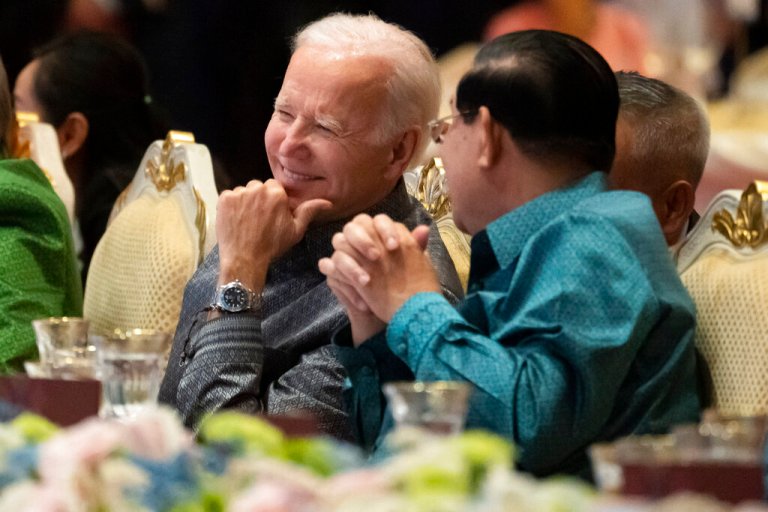 FILE - U.S. President Joe Biden, left, and Cambodian Prime Minister Hun Sen share a moment as they watch a cultural dance performance at the Association of Southeast Asian Nations (ASEAN) gala dinner, Saturday, Nov. 12, 2022, in Phnom Penh, Cambodia. Hun Sen said Tuesday, Nov. 15, 2022, he has tested positive for COVID-19 at the Group of 20 meetings in Bali, just days after hosting many world leaders, including President Joe Biden, for a summit in Phnom Penh. 