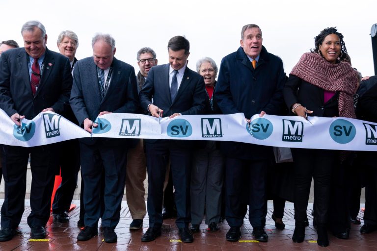 From left, Metropolitan Washington Airports Authority President and CEO Jack Potter, Sen. Tim Kaine (D-VA), Transportation Secretary Pete Buttigieg, Sen. Mark Warner (D-VA), and D.C. Mayor Muriel Bowser during the ribbon-cutting on Washington Dulles International Airport station platform at the opening of new Silver Line Extension at Washington Dulles International Airport, in Chantilly, Virginia., on Tuesday, Nov. 15, 2022. 