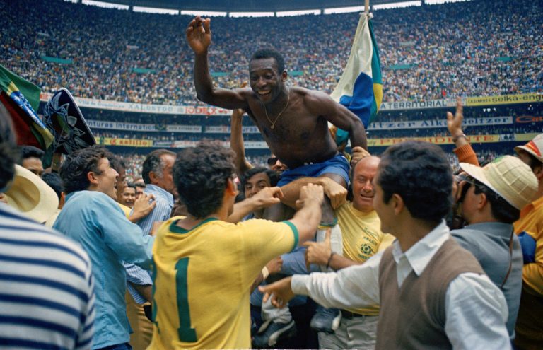 Brazil's Pele, center, is hoisted on the shoulders of his teammates after Brazil won the World Cup soccer final against Italy, 4-1, in Mexico City's Estadio Azteca, Mexico, in 1970.