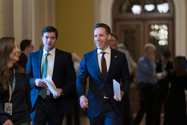 Sen. Josh Hawley, (R-MO), smiles as he arrives to support Sen. Rick Scott, R-FL), in the Senate Republican leadership elections, at the Capitol in Washington, Wednesday, Nov. 16, 2022. (AP Photo/J. Scott Applewhite)