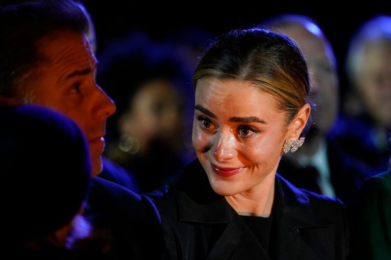 Hunter Biden holds his son Beau as President Joe Biden's granddaughter Naomi Biden smiles as they attend the lighting of National Christmas Tree on the Ellipse of the White House in Washington, Wednesday, Nov. 30, 2022.
