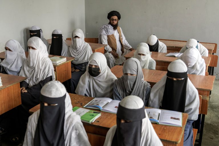 Afghan girls attend a religious school, which remained open since the last year's Taliban takeover, in Kabul, Afghanistan, on Aug. 11, 2022.