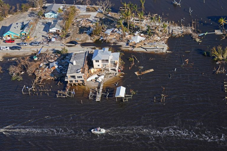 FILE - The bridge leading from Fort Myers to Pine Island, Fla., is seen heavily damaged in the aftermath of Hurricane Ian on Pine Island, Fla., Oct. 1, 2022. (AP Photo/Gerald Herbert, File)
