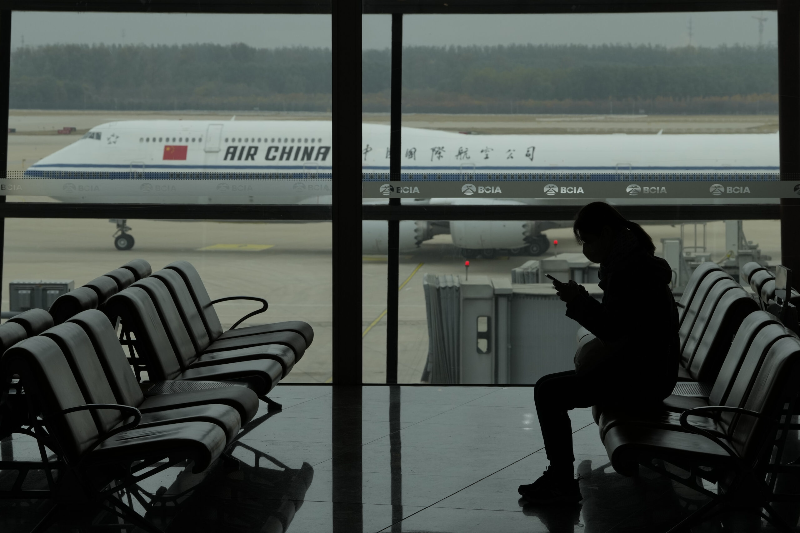 China to end quarantine requirements for travelers despite surge in COVID cases