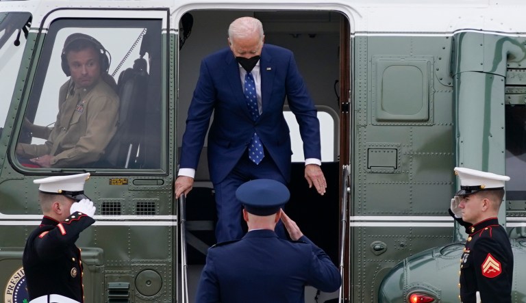 President Joe Biden exits Marine One as he arrives to board Air Force One at Andrews Air Force Base.