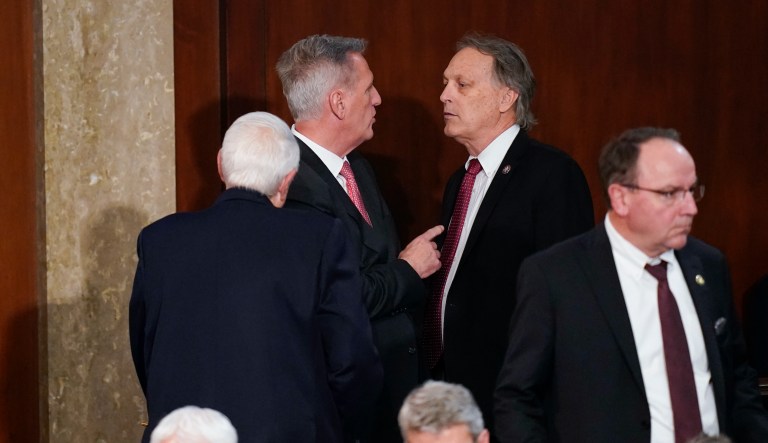 Rep. Andy Biggs, R-Ariz., right, talks with Rep. Kevin McCarthy, R-Calif., during the tenth vote in the House chamber as the House meets for the third day to elect a speaker and convene the 118th Congress in Washington, Thursday, Jan. 5, 2023.