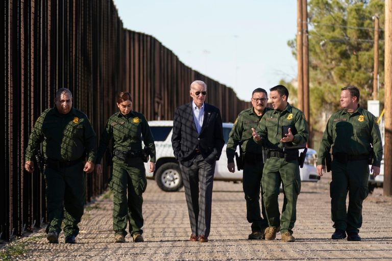 President Joe Biden talks with Border Patrol agents as they walk along a stretch of the U.S.-Mexico border in El Paso, Texas, Sunday, Jan. 8, 2023. 