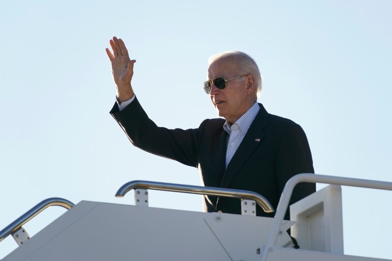 President Joe Biden waves before boarding Air Force One at El Paso International Airport in El Paso, Texas, Sunday, Jan. 8, 2023, to travel to Mexico City, Mexico.