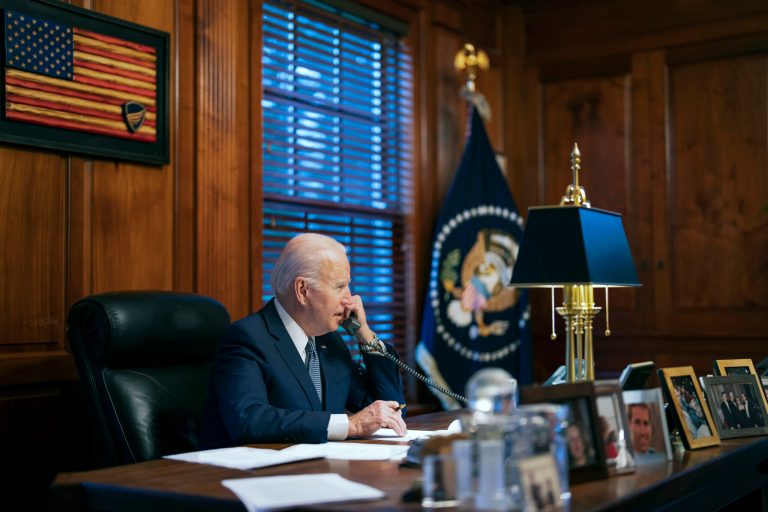 In this image provided by the White House, President Joe Biden speaks with Russian President Vladimir Putin on the phone from his private residence in Wilmington, Del., Dec. 30, 2021.