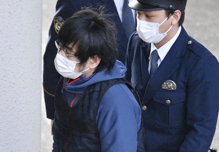 Tetsuya Yamagami, the alleged assassin of Japan's former Prime Minister Shinzo Abe, enters a police station in Nara, western Japan, on Jan. 10, 2023. 