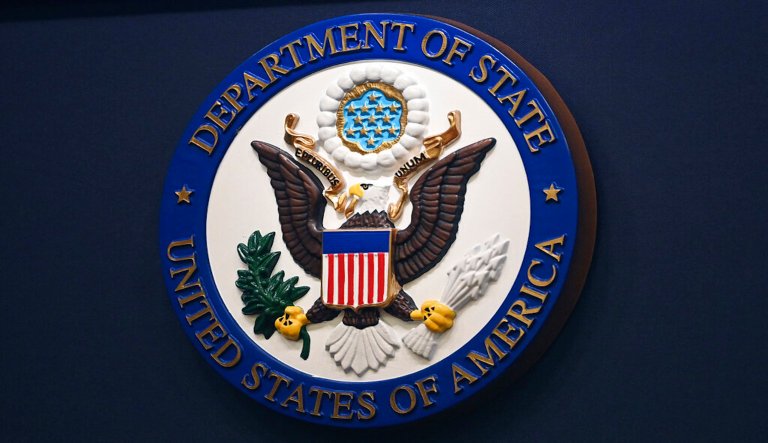 The State Department seal is seen on the briefing room lectern at the State Department in Washington, Jan. 31, 2022.